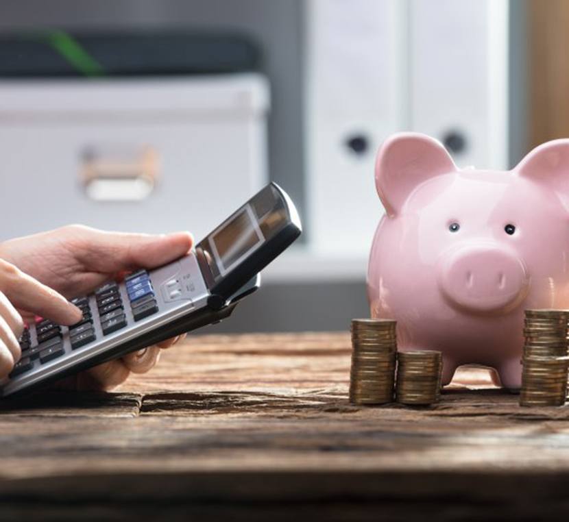 Pocket calculator and piggy bank