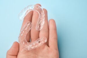 Clear aligners on palm of hand