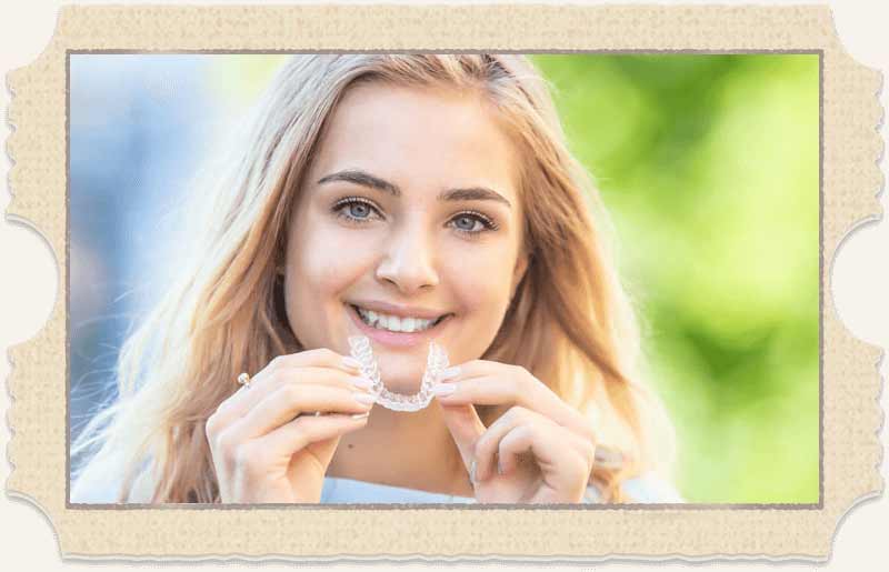Patient smiling with Invisalign